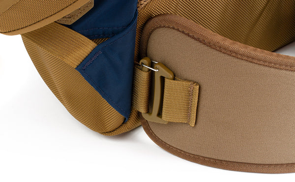 A close shot of the attachment point of the padded hip belt on the Guide's Pack.